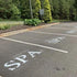 Custom parking lot stencil applied to a spa parking lot